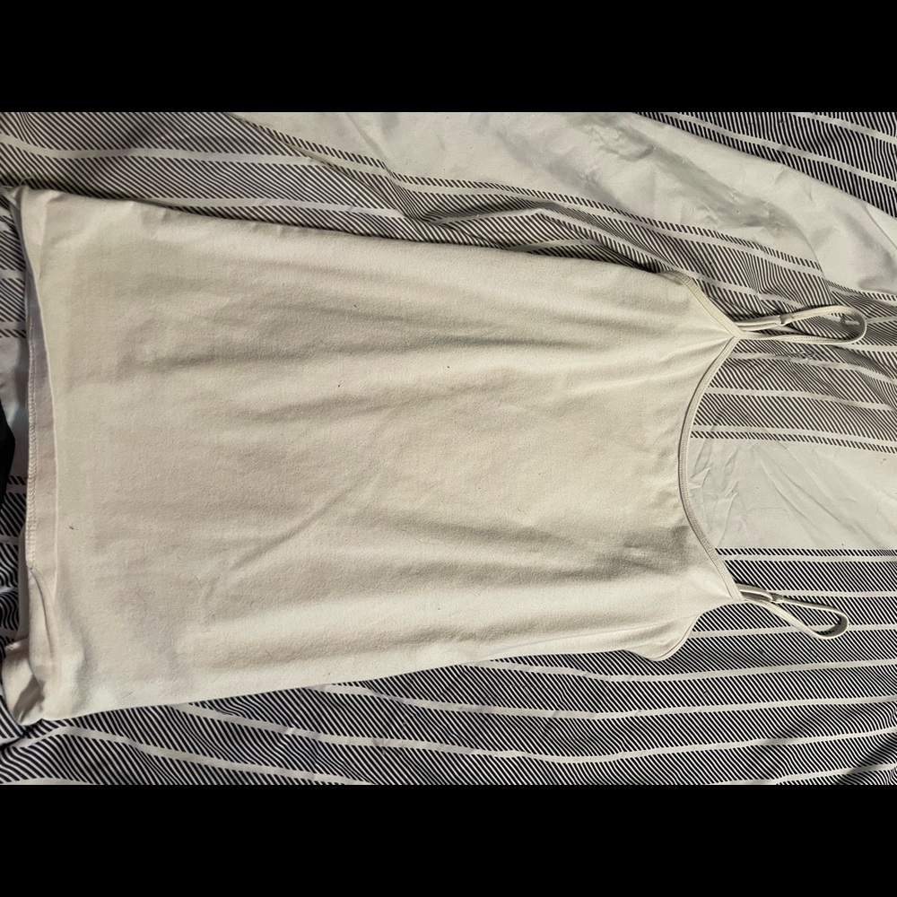 4 white tank tops